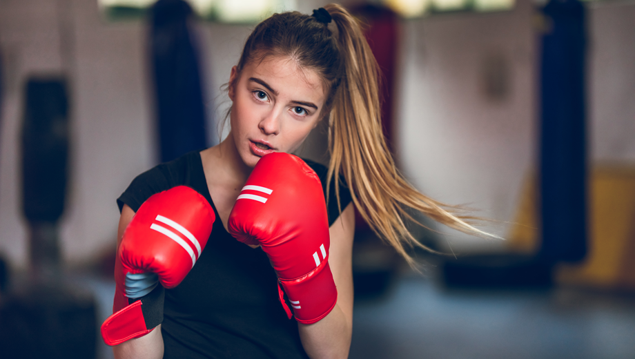 Young girl boxing in a gym