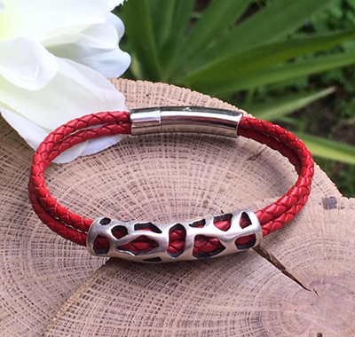 Red leather bracelet with laced metal decoration