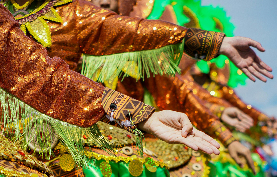 Persian women performing traditional dance in colourful costumes.