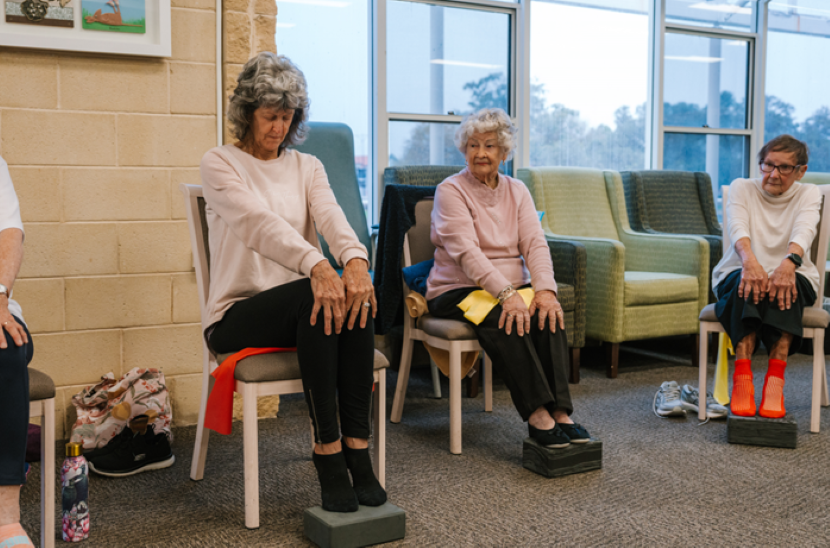 Older ladies exercising on a chair