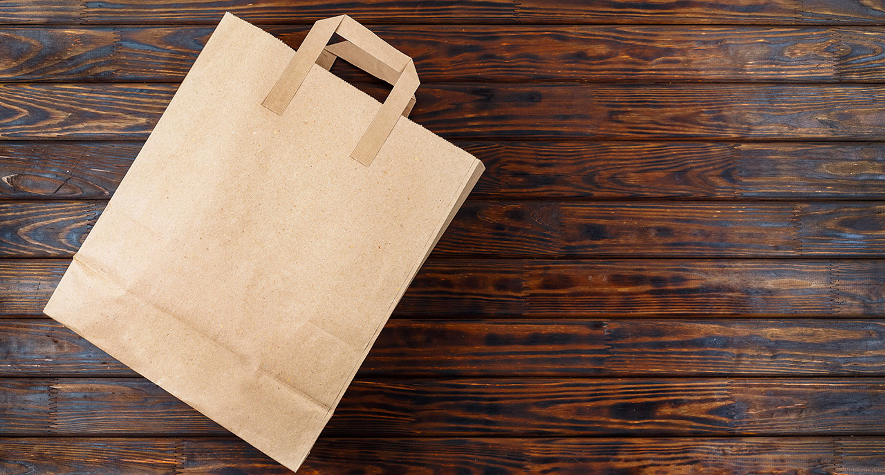 brown bag on wood table