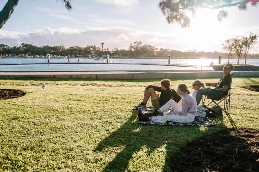 Group of people sitting on Eastern Foreshore overlooking Kwillena Gabi Pool