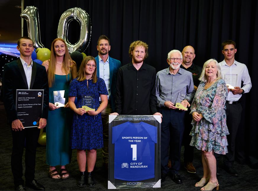 Group photo of winners smiling at the camera