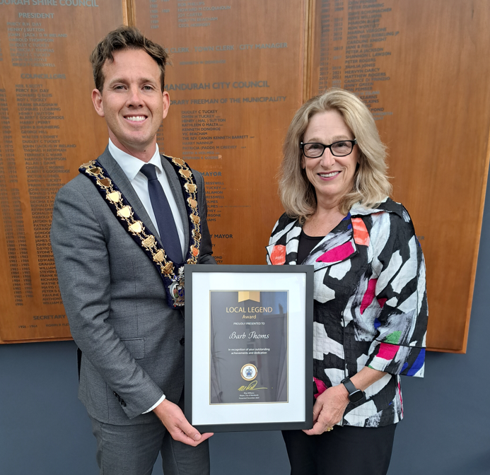 Mayor Rhys Williams stands beside Barb Thoms with the award