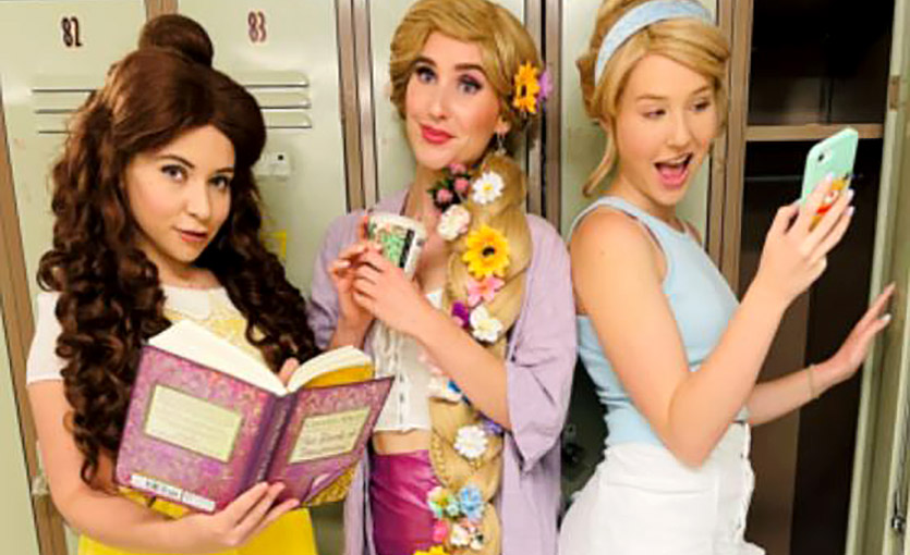 Three girls stand next to each other at school lockers