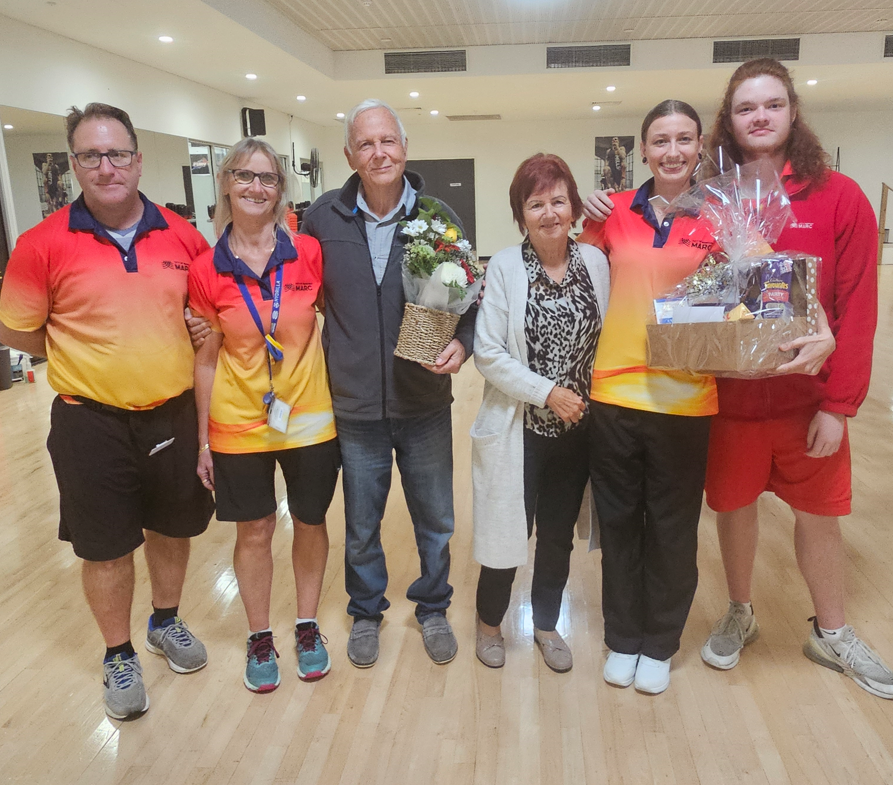 Four lifeguards stand with Heinz and wife Hedi