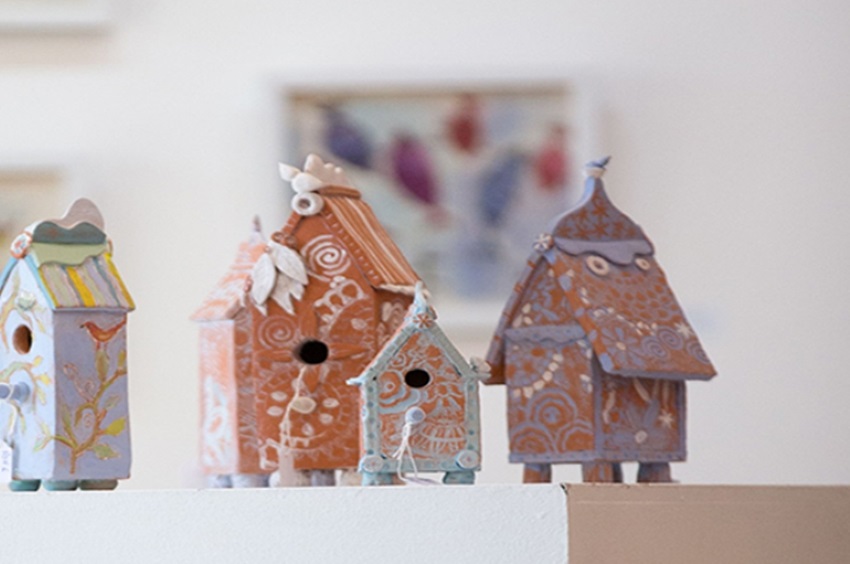 four little ceramic houses