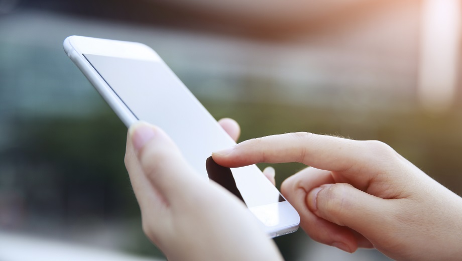 Person using smart mobile phone