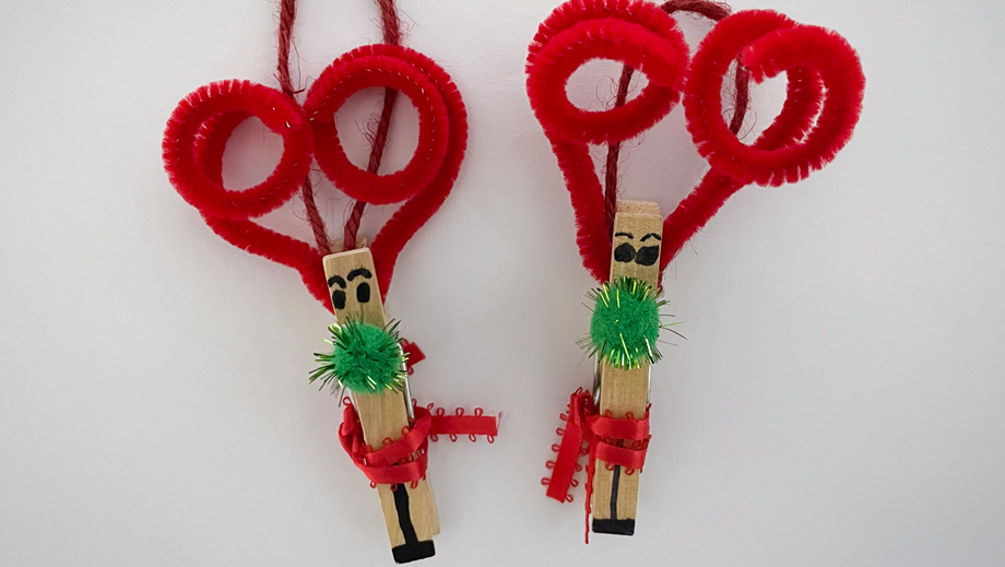 Two reindeer crafts made from pegs and other materials.