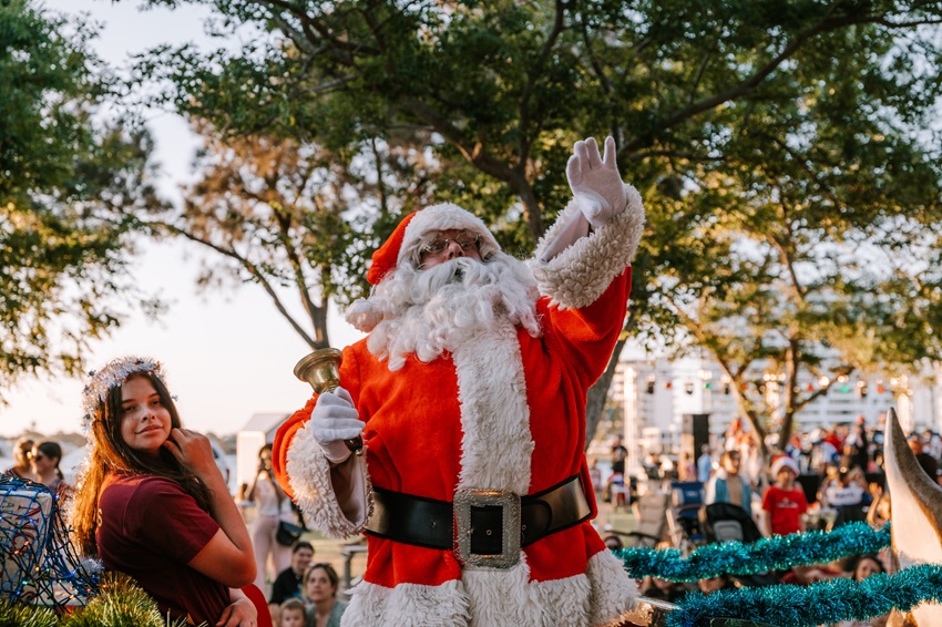 Santa on a float waving to crowd