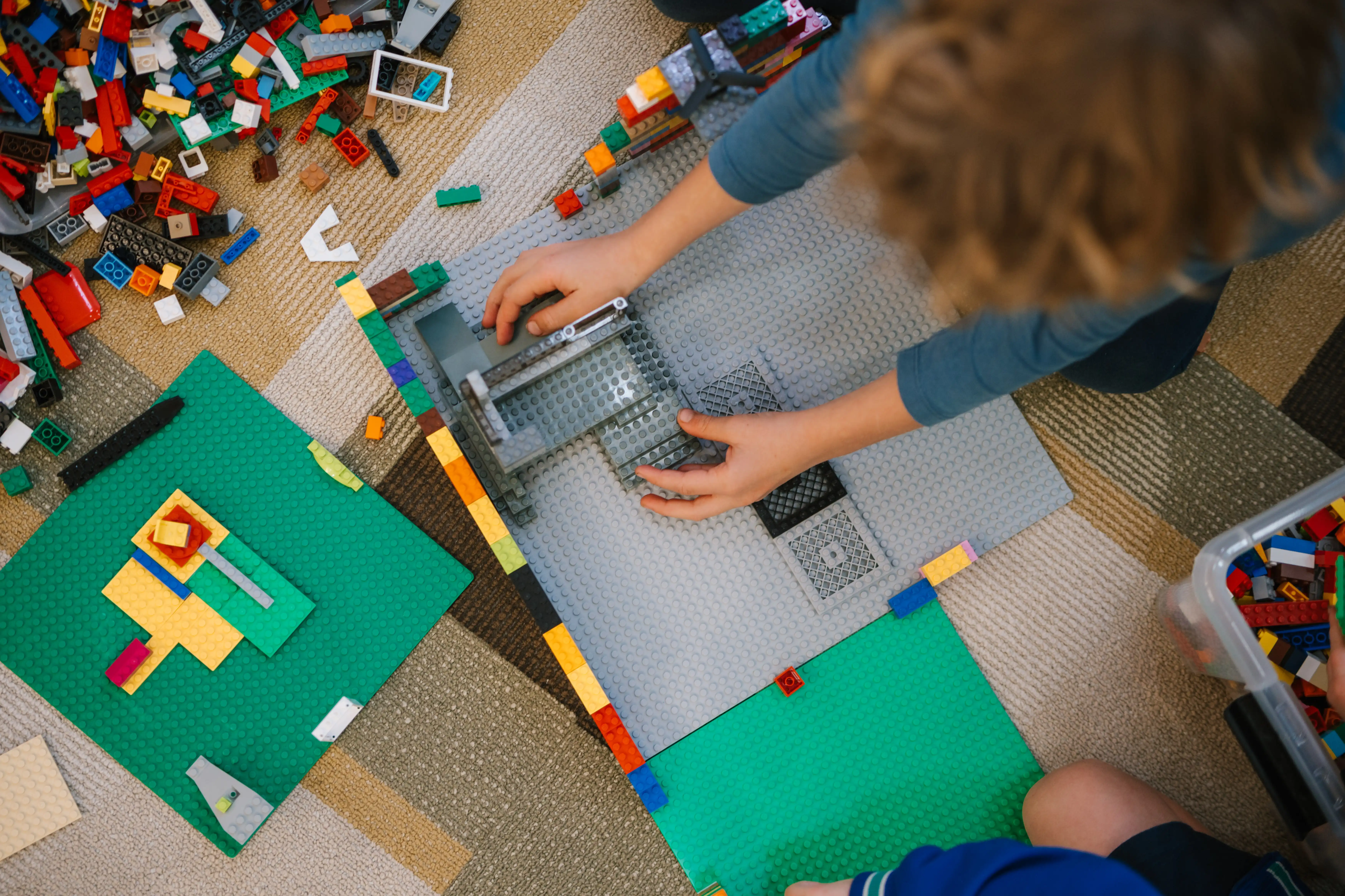 Child playing with lego.