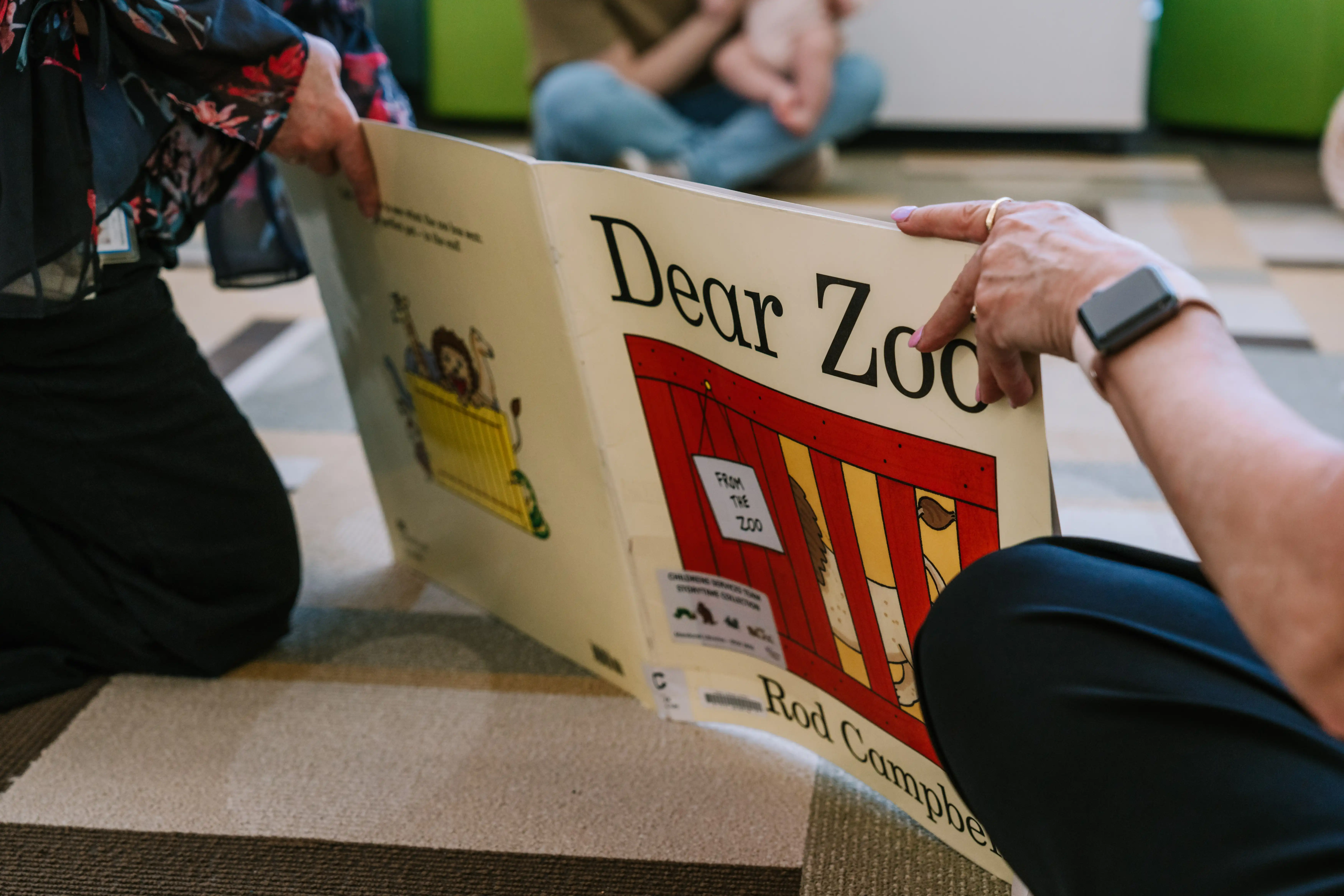 Dear Zoo kids book held by hands.