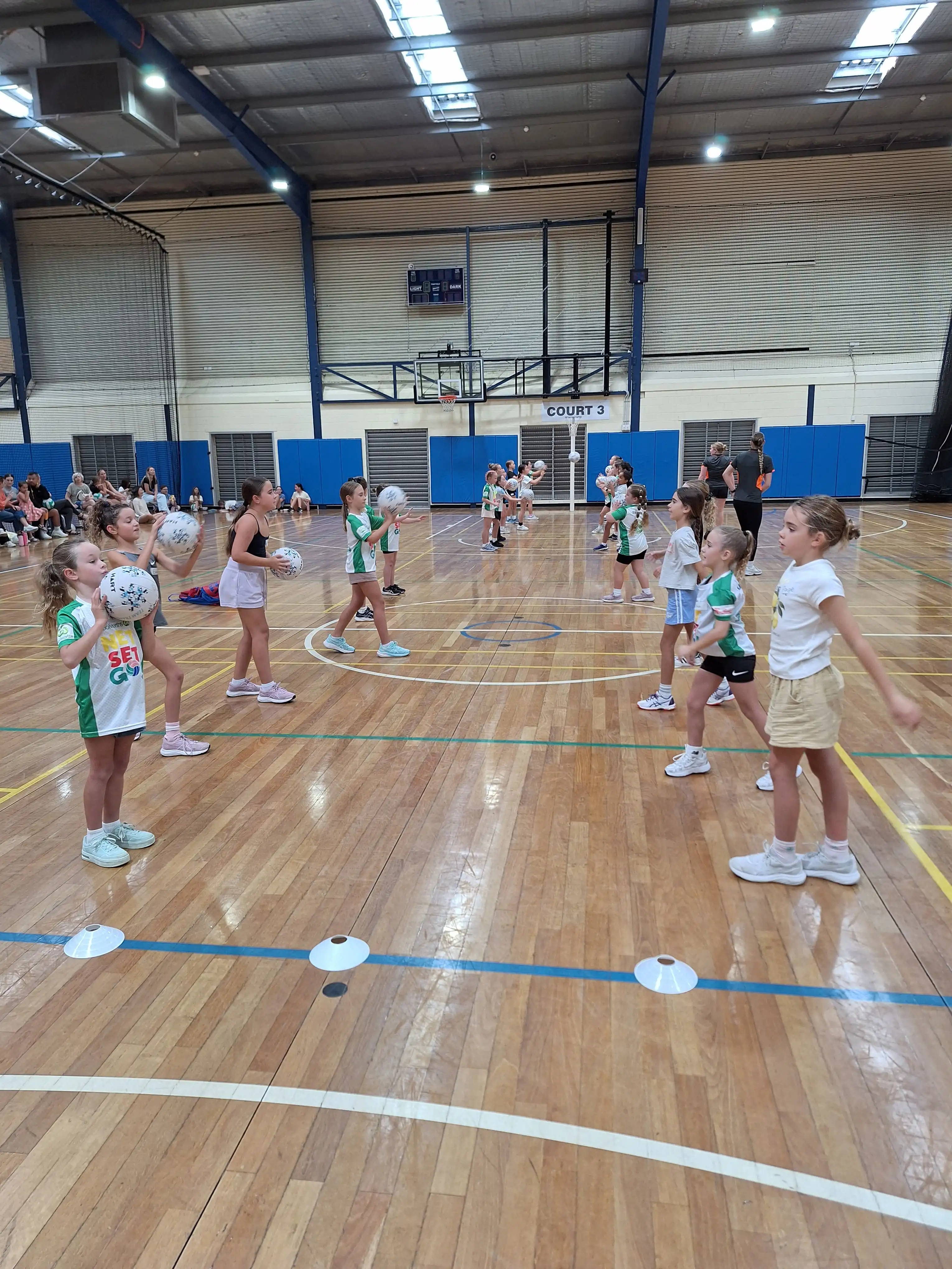 Children playing netball on court 