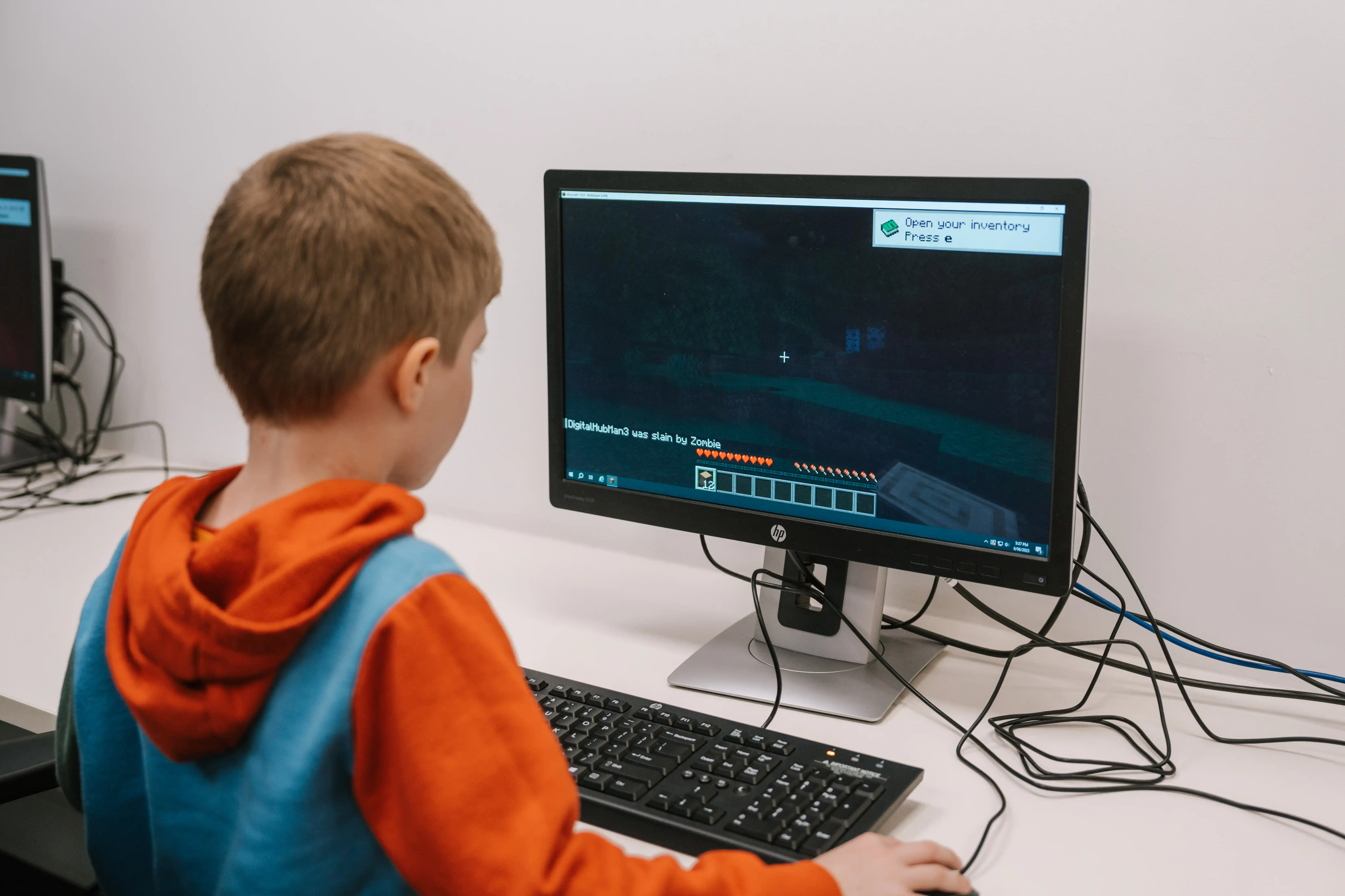 Child playing game on computer.